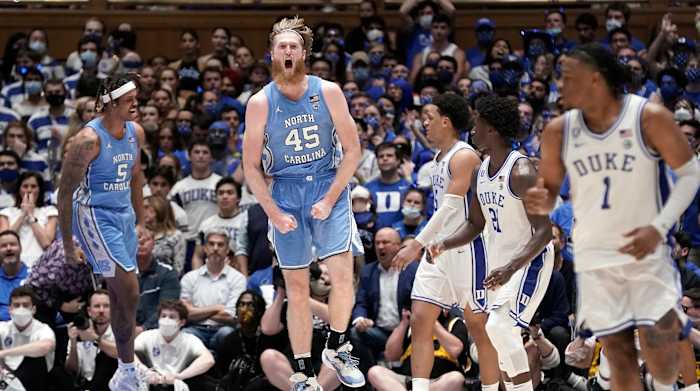 North Carolina forward Brady Manek (45) and forward Armando Bacot (5) react following a play during the second half of the team's NCAA college basketball game against Duke in Durham, N.C., Saturday, March 5, 2022.